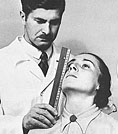 Image of a man measuring girl's nose