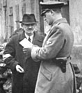 Image of German soldier checking papers